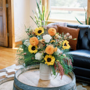 Honey Reign is bursting with orange dahlias, buttery sunflowers, and soft cream roses. It’s rebirth in bloom.